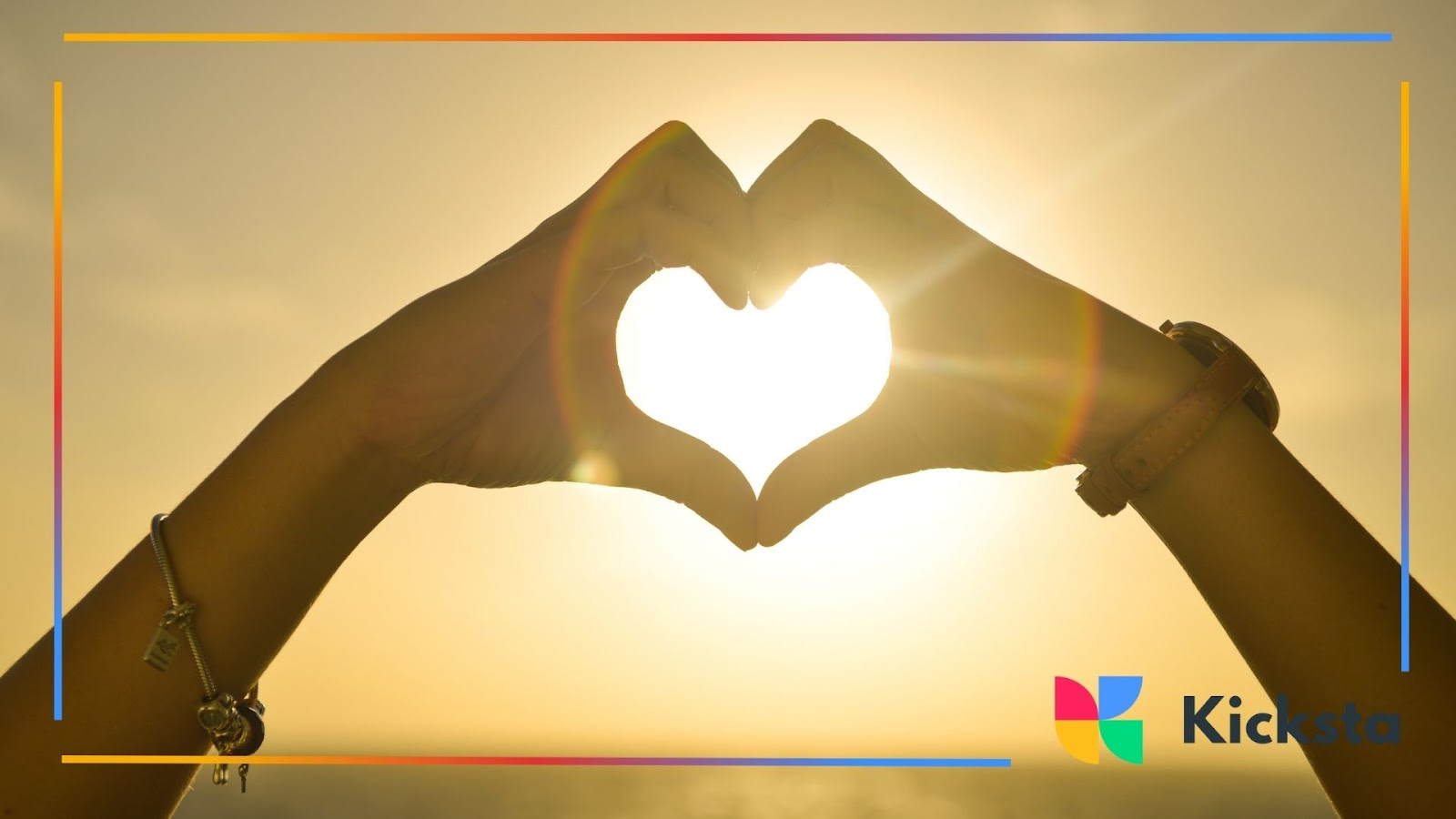 Two hands shape a glowing heart as the sun shines through, symbolizing warmth, unity, and pure love