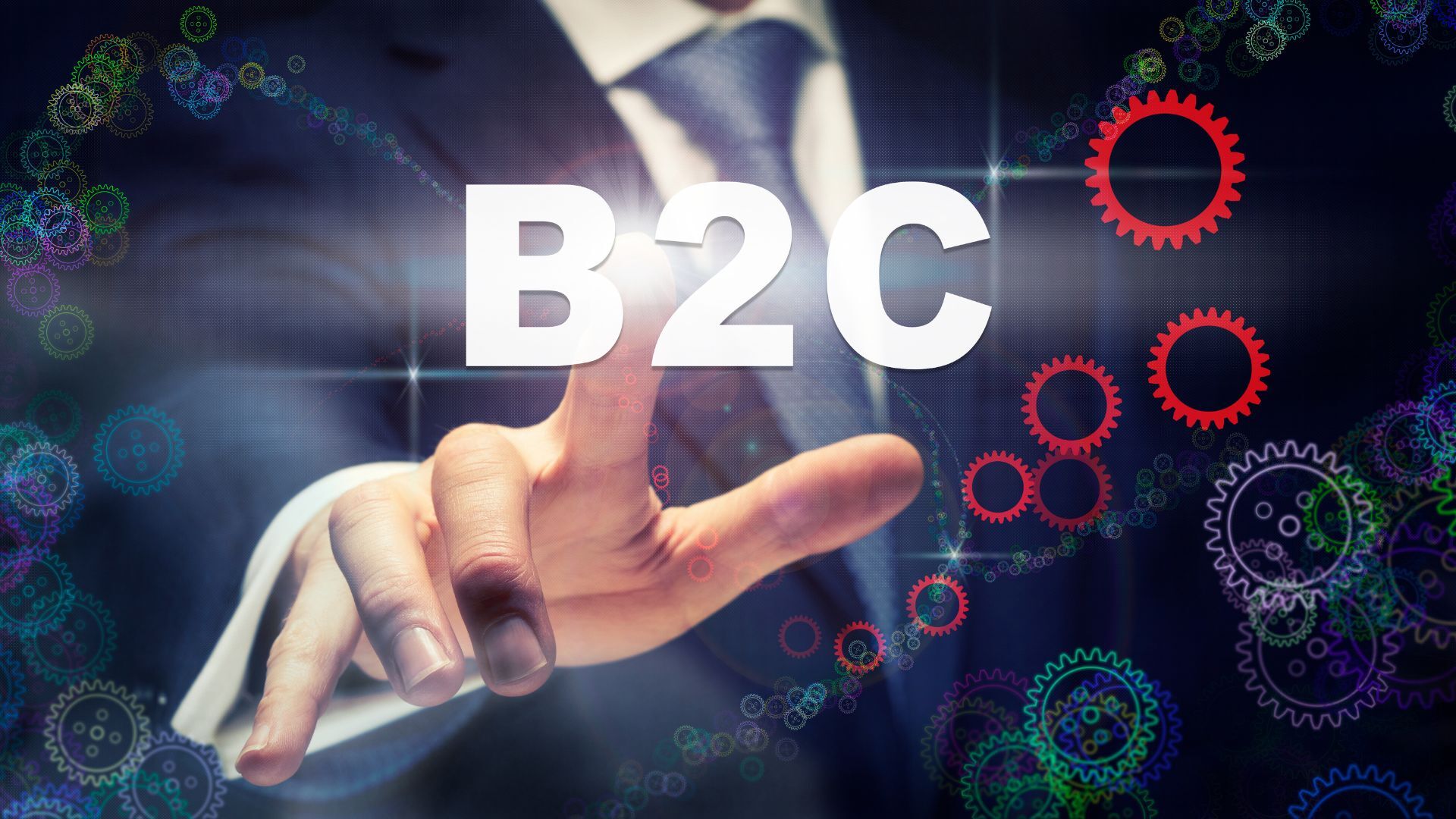 Businessman touching a virtual B2C icon surrounded by colorful gears, symbolizing customer-focused strategies.