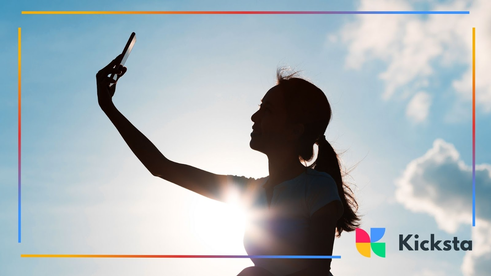 A silhouette of a woman taking a selfie under a bright, open sky
