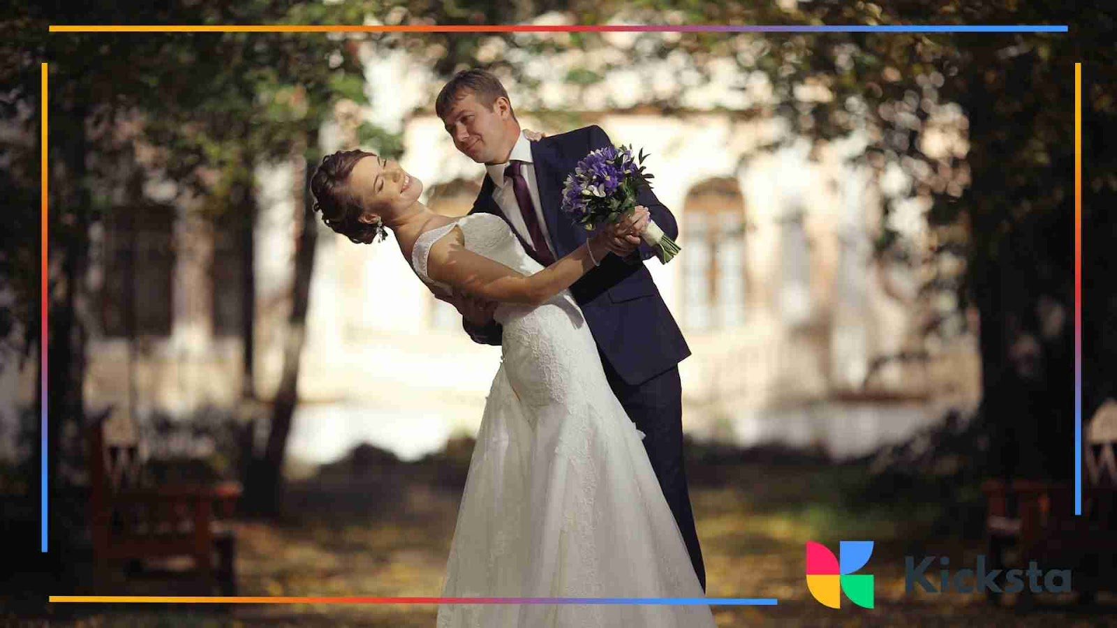 Bride and groom dancing outside on their wedding day