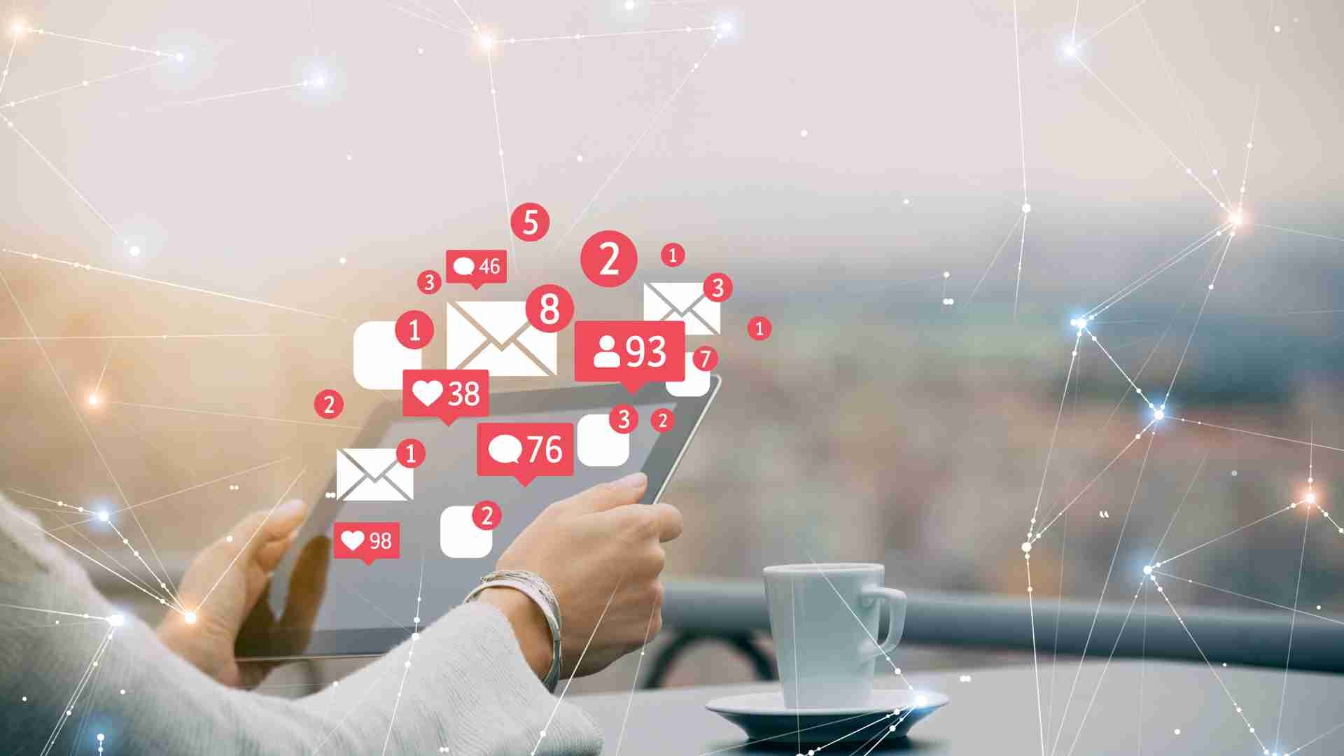 Person holding a tablet displaying numerous Instagram notifications for likes, comments, and messages.