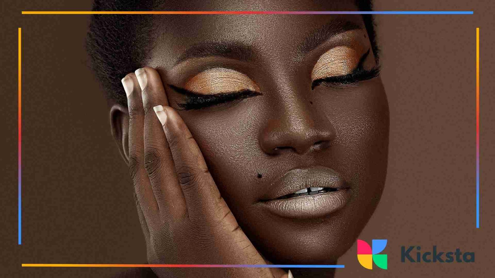 Close-up of woman with flawless golden eyeshadow.