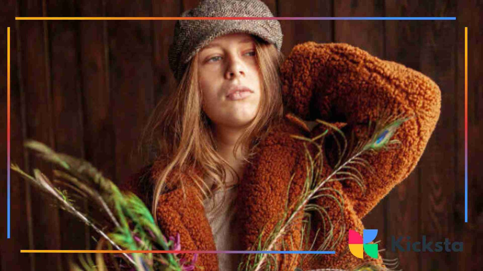 Bohemian fashion with woman wearing textured coat, flat cap, and holding feathers.