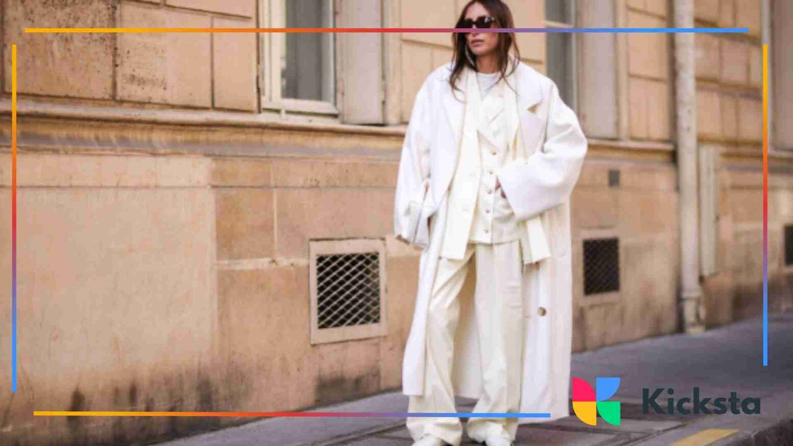 Fashion Girlie aesthetic with woman in oversized all-white outfit and sunglasses.