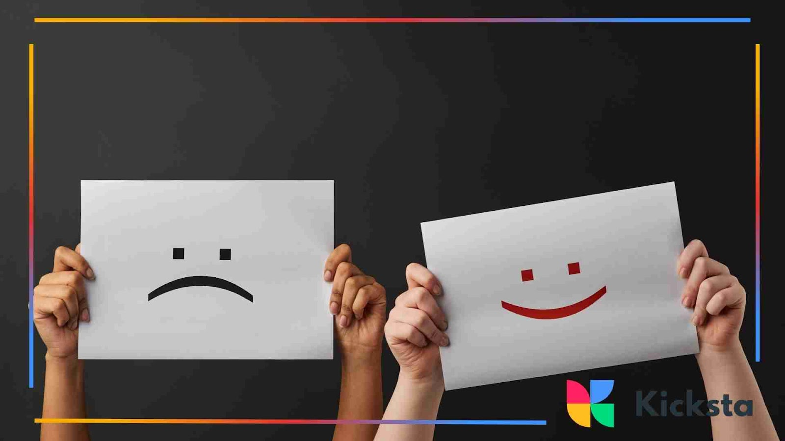 Hands holding up paper signs one with a sad face, the other with a smiling face