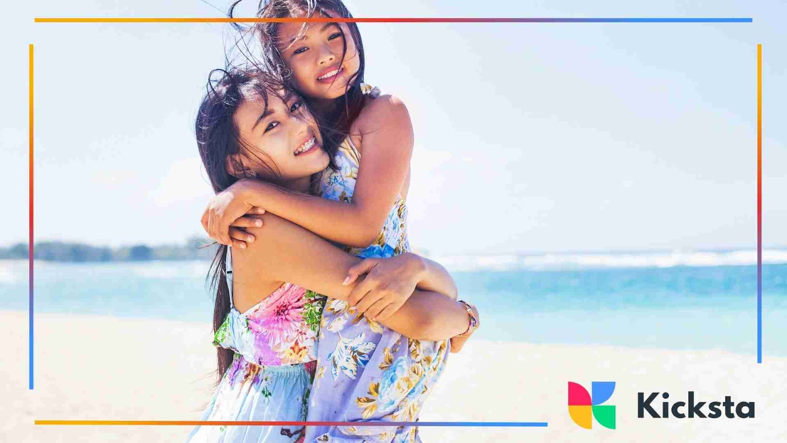 Sisters hugging at the beach