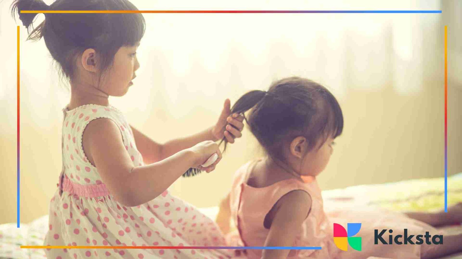 Little girl brushing her younger sister’s hair