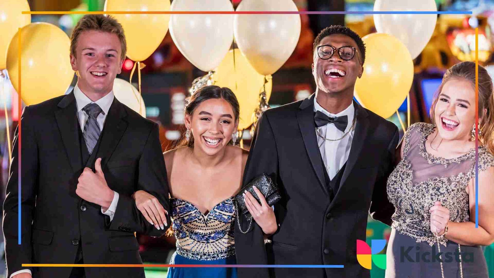 Group of teens in formal wear laughing together at a party.