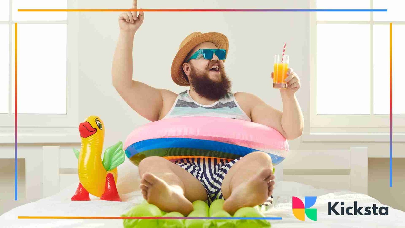 Bearded man in sunglasses, hat, and floatie, holding a drink indoors