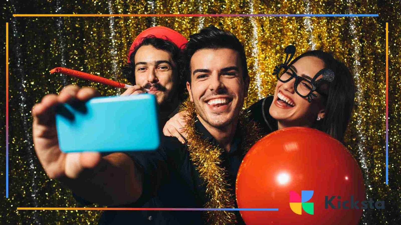 Group of friends at a party laughing and taking a selfie