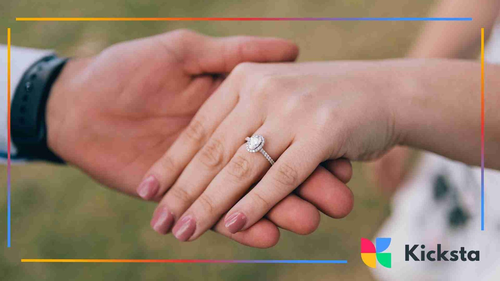 Close-up of couple holding hands showing engagement ring
