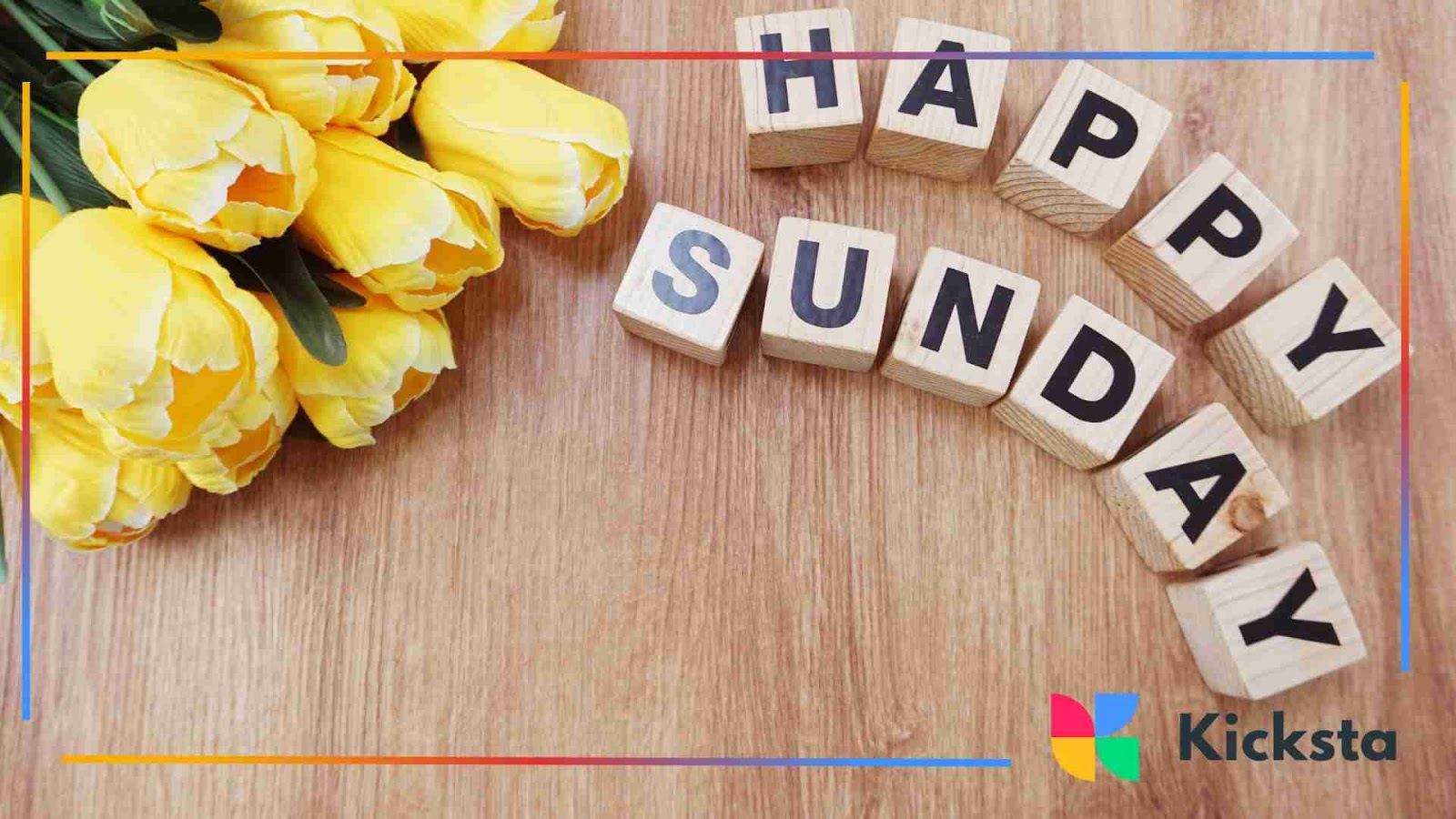 Yellow tulips with wooden letter blocks spelling ‘Happy Sunday’ on a table.