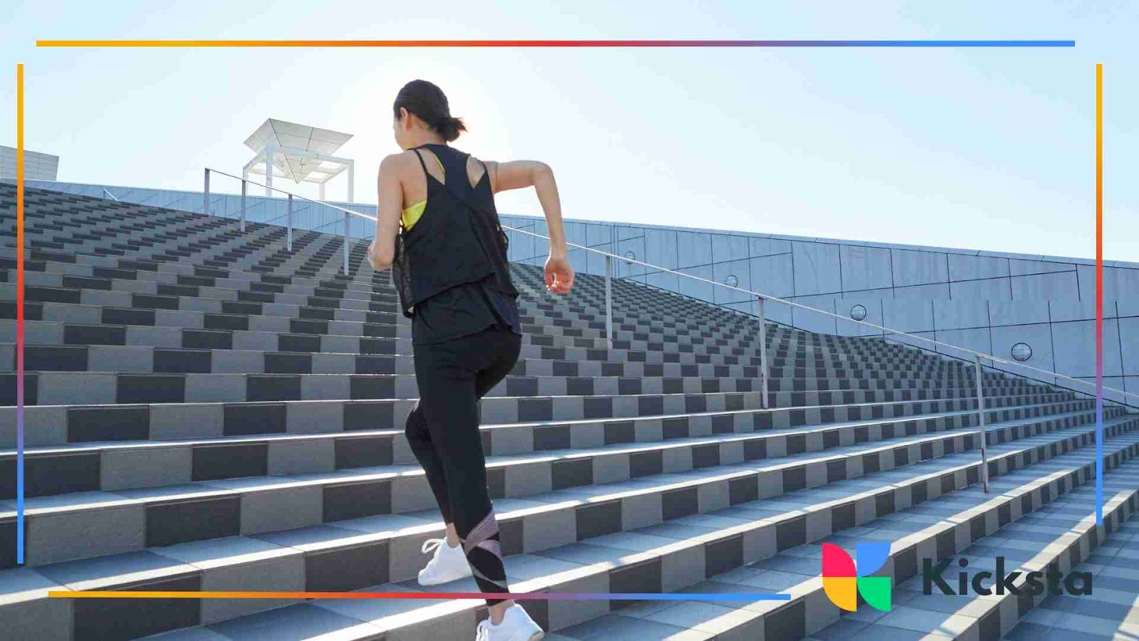 Woman running up outdoor stadium steps during Sunday workout.