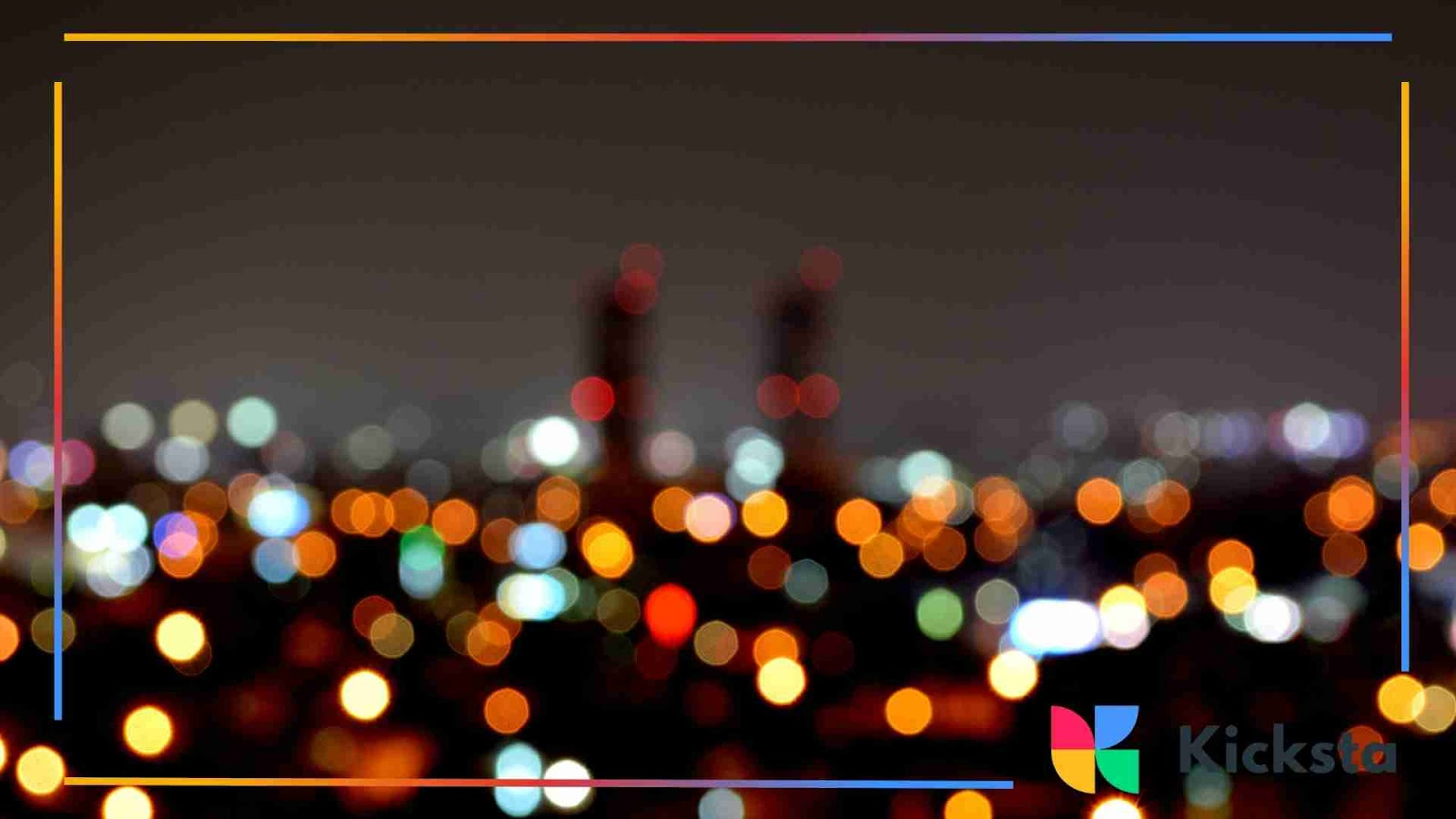 Blurry city lights at night creating a vibrant bokeh effect.