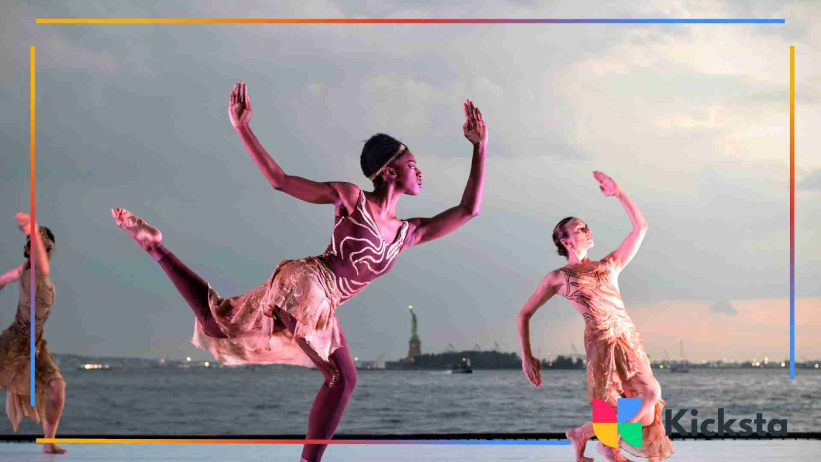Dancers performing an expressive routine outdoors