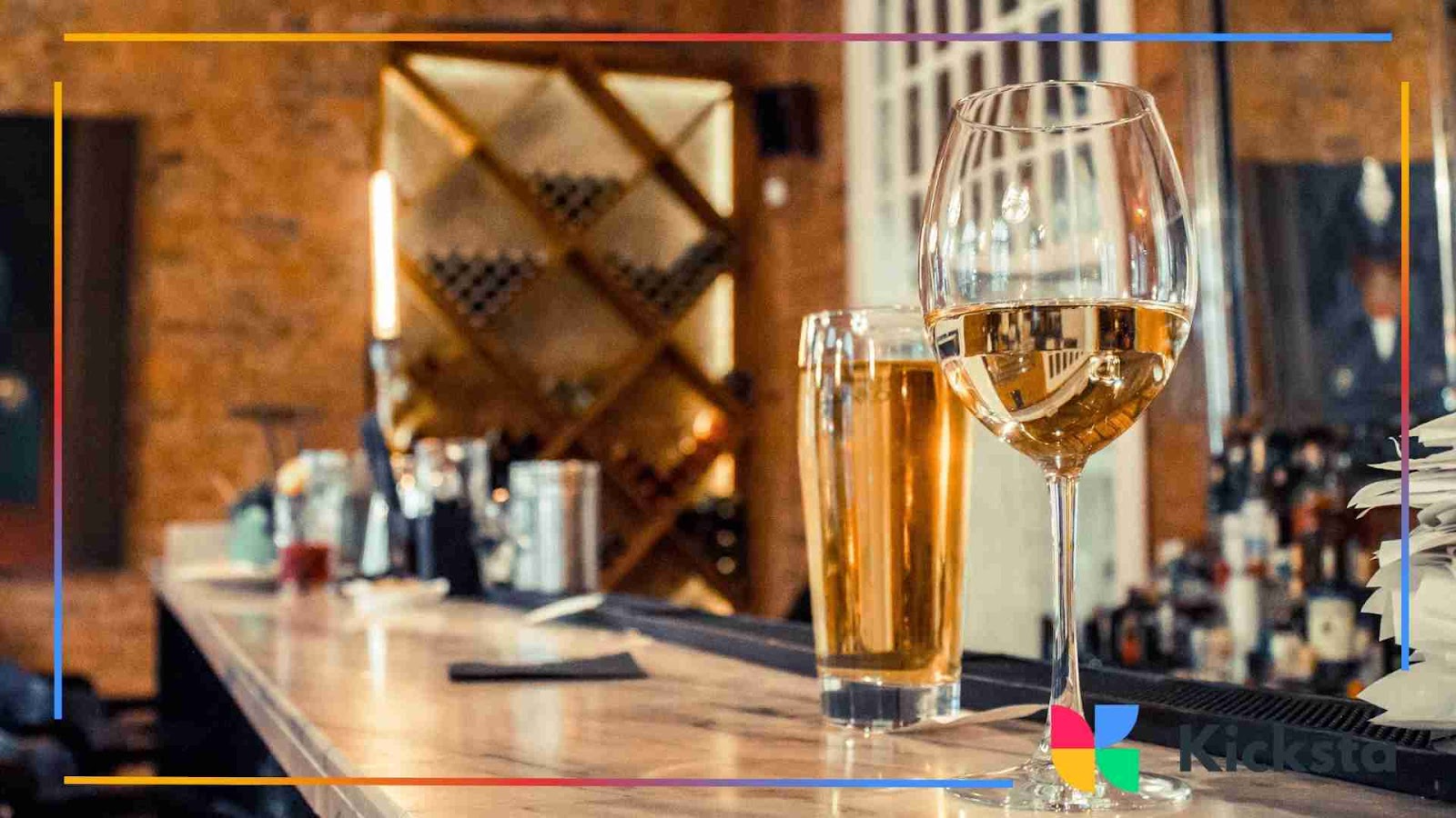 Classy wine and beer glasses on a wooden bar counter
