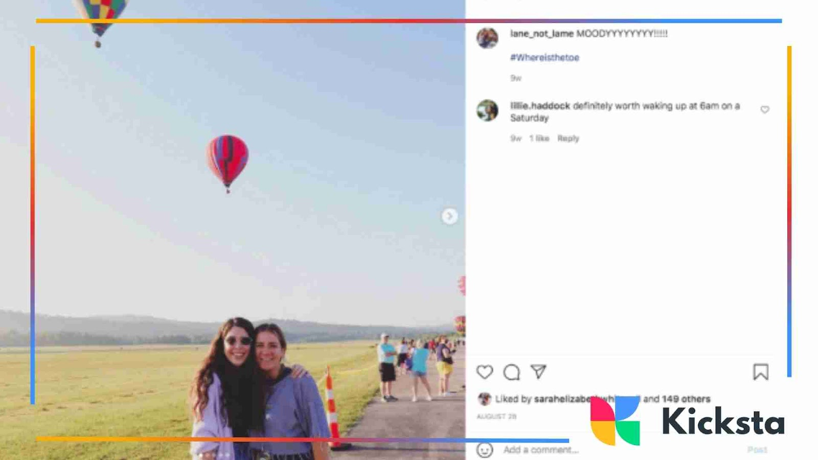 Friends smiling for an Instagram photo at a field with hot air balloons in the sky.