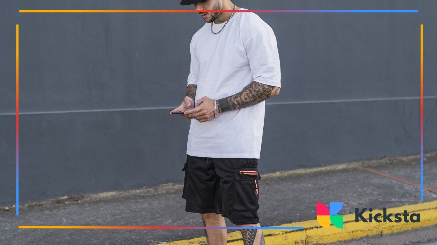 boy standing on the streets with tattoos and bad boy vibes