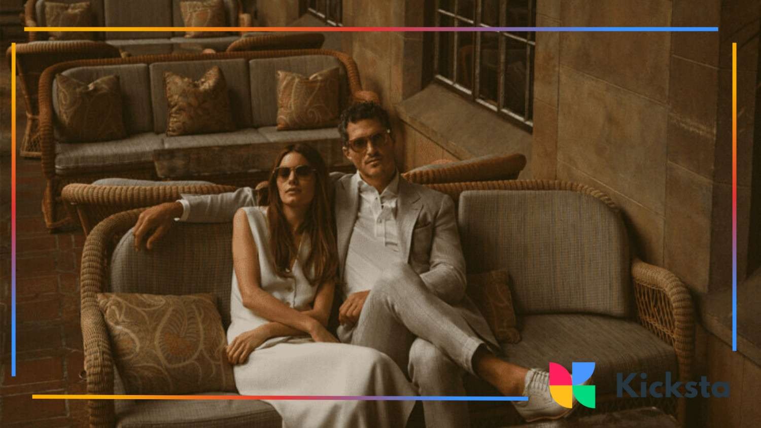 classy man and woman sitting on the coach