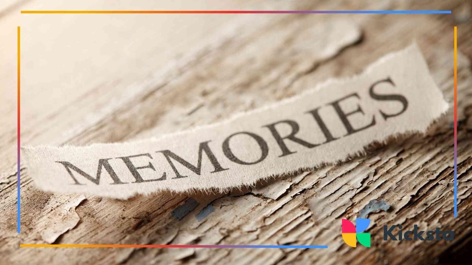 Torn piece of paper with the word “MEMORIES” printed on it placed on a rustic wooden surface.