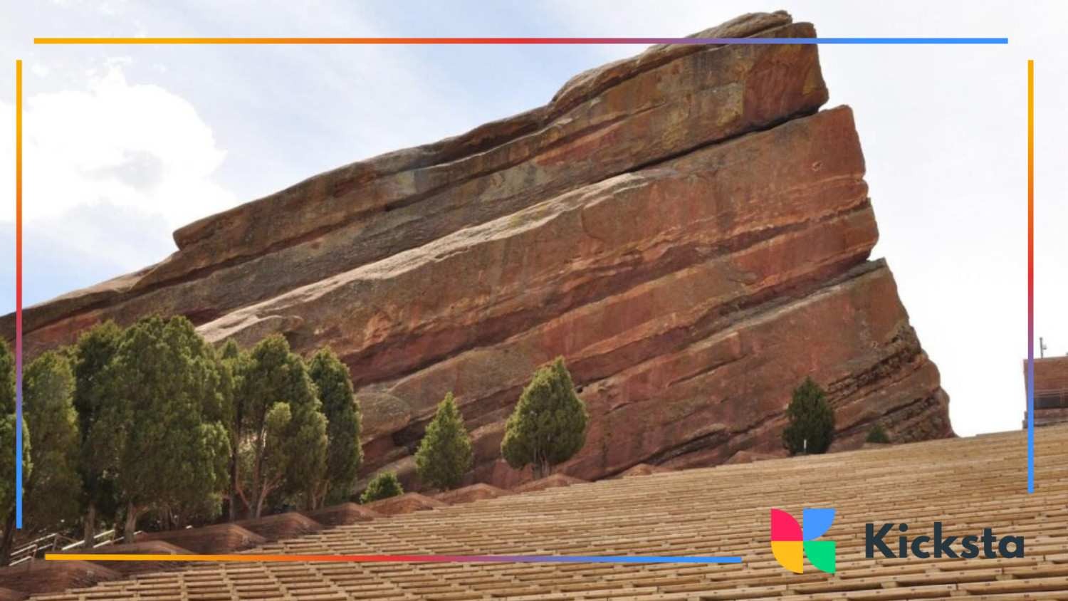 Red Rocks Amphitheatre in Colorado featuring slanted sandstone formations and rows of outdoor seating surrounded by trees.