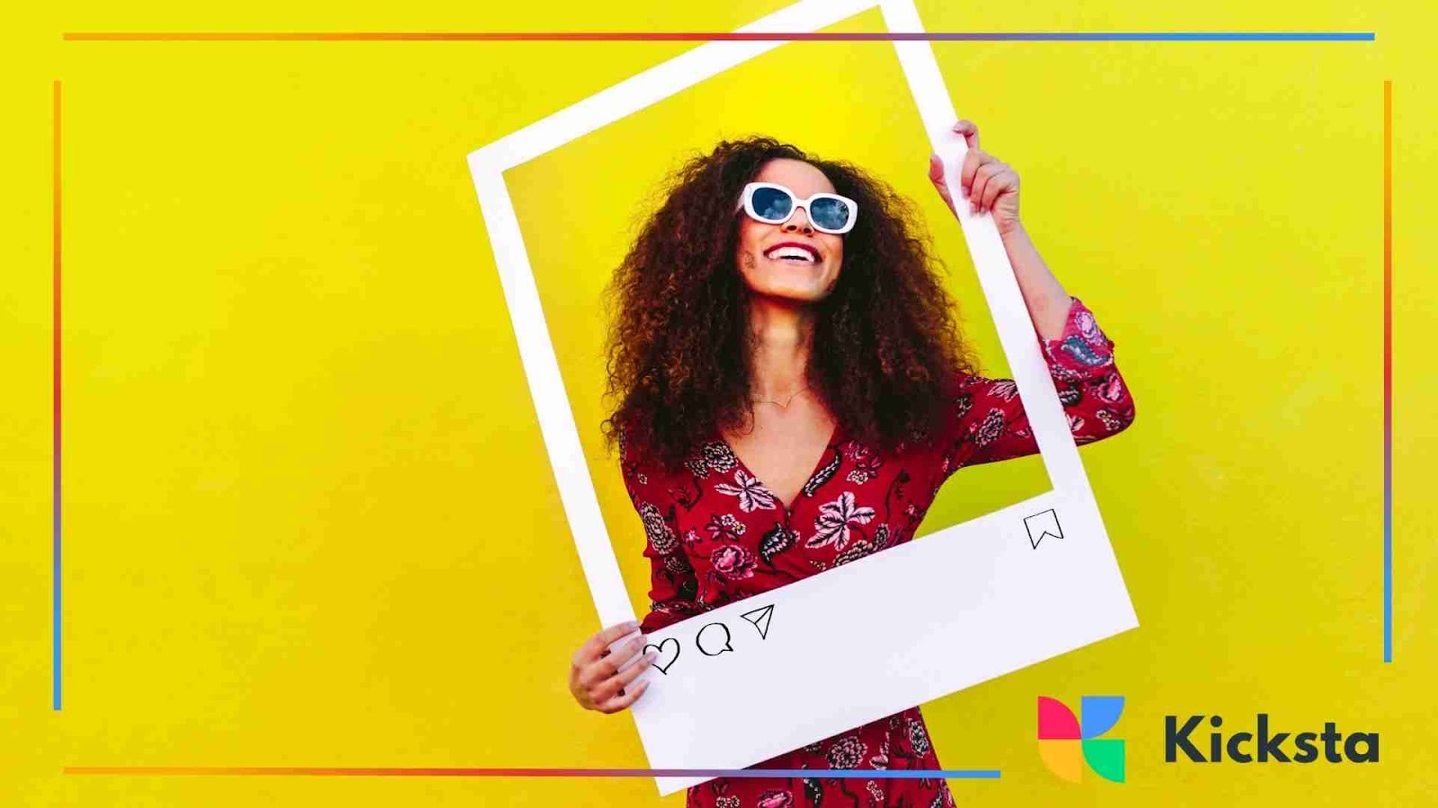 Smiling woman with curly hair wearing sunglasses and a red floral dress, holding a large Instagram-style photo frame against a bright yellow background.