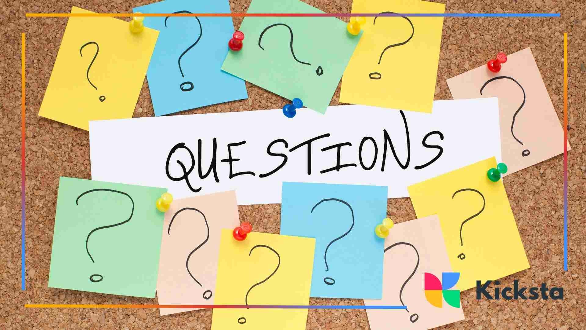 Colorful sticky notes with question marks pinned on a corkboard.