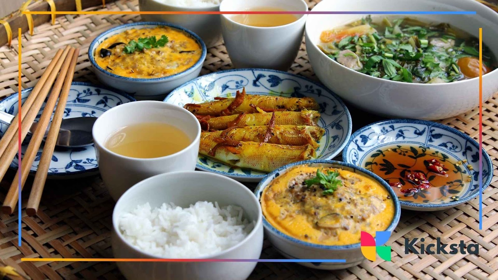 Delicious Vietnamese meal with rice, steamed dishes, soup, and tea served in traditional bowls for authentic food blogging content.