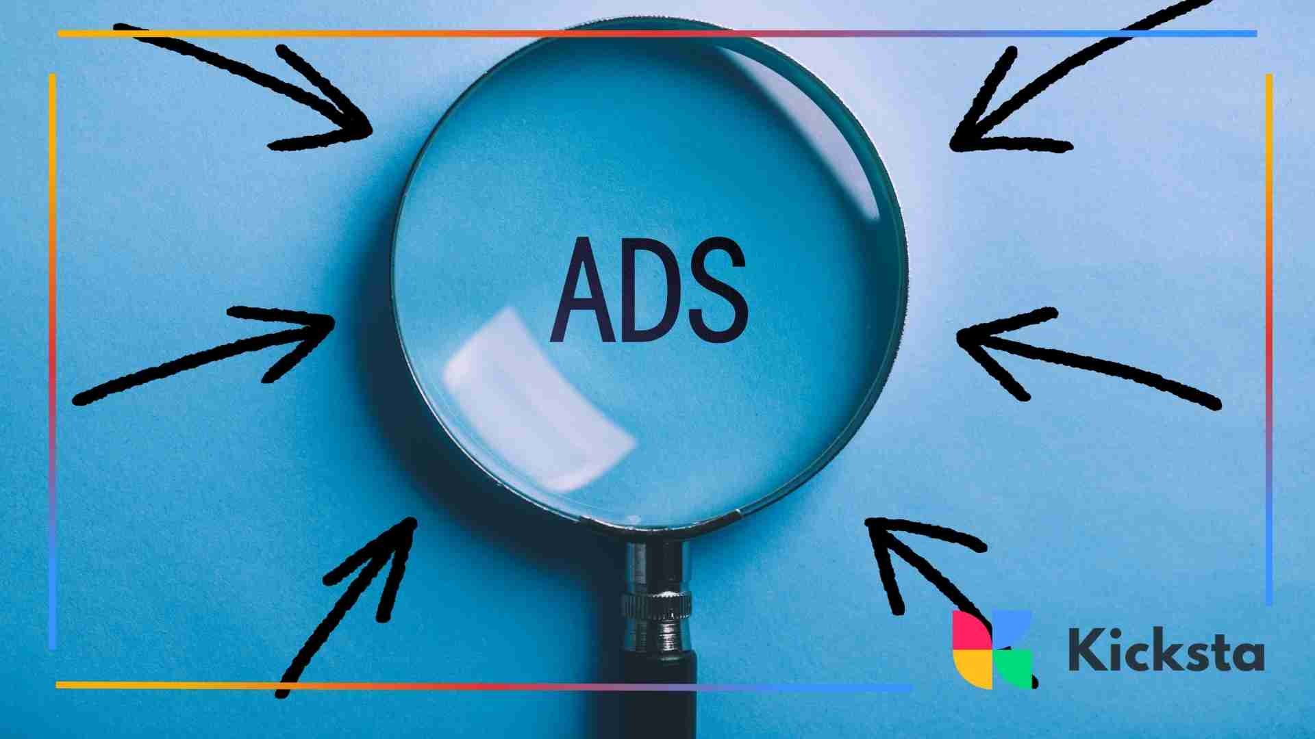 Magnifying glass highlighting the word “ADS” on a blue background.