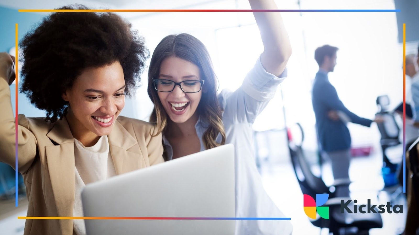 Excited women celebrating success while looking at laptop in modern office, representing business growth, teamwork, and digital marketing results.