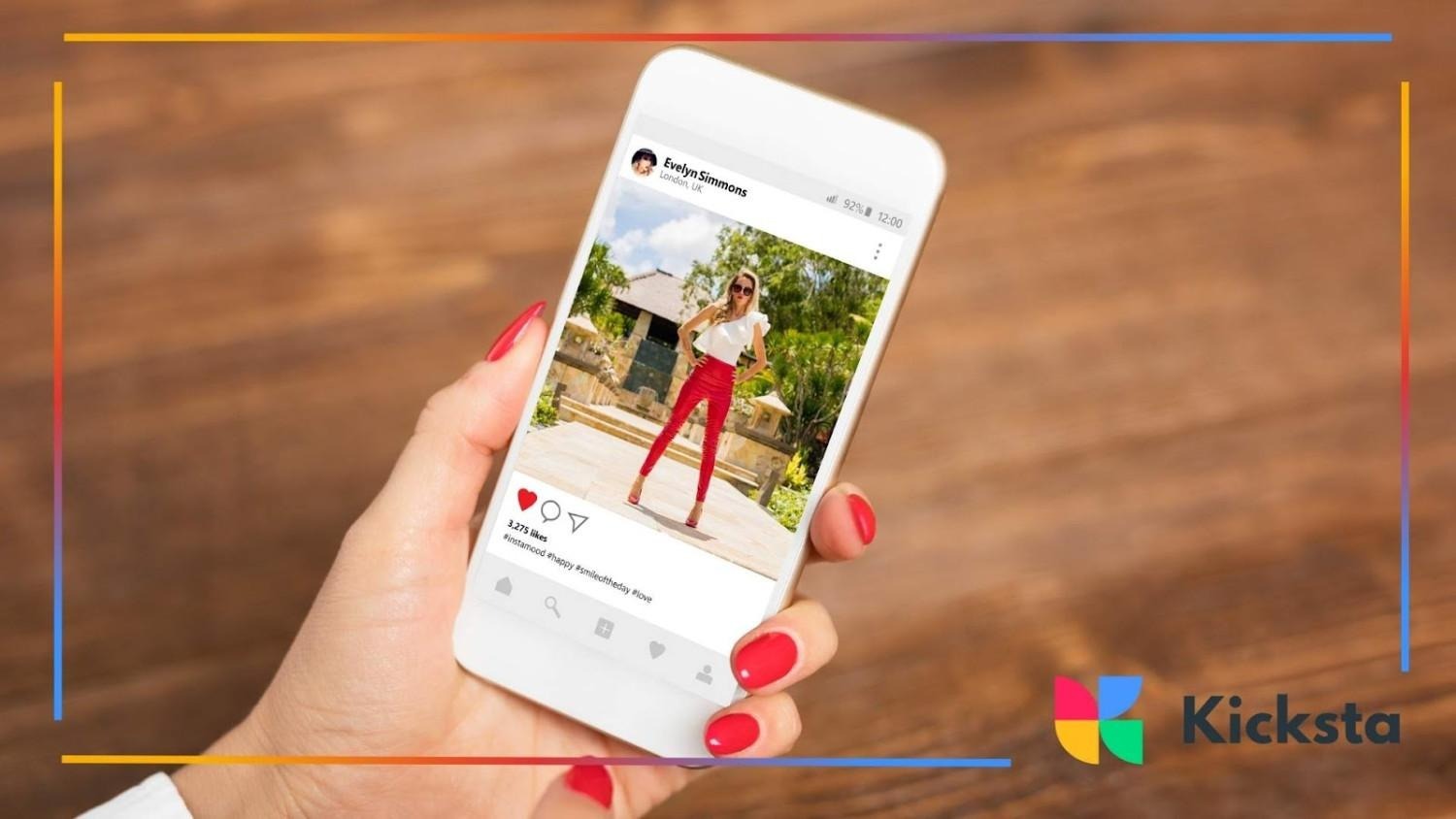 Hand holding smartphone showing Instagram post of fashion influencer posing outdoors, symbolizing social media engagement and influencer marketing.