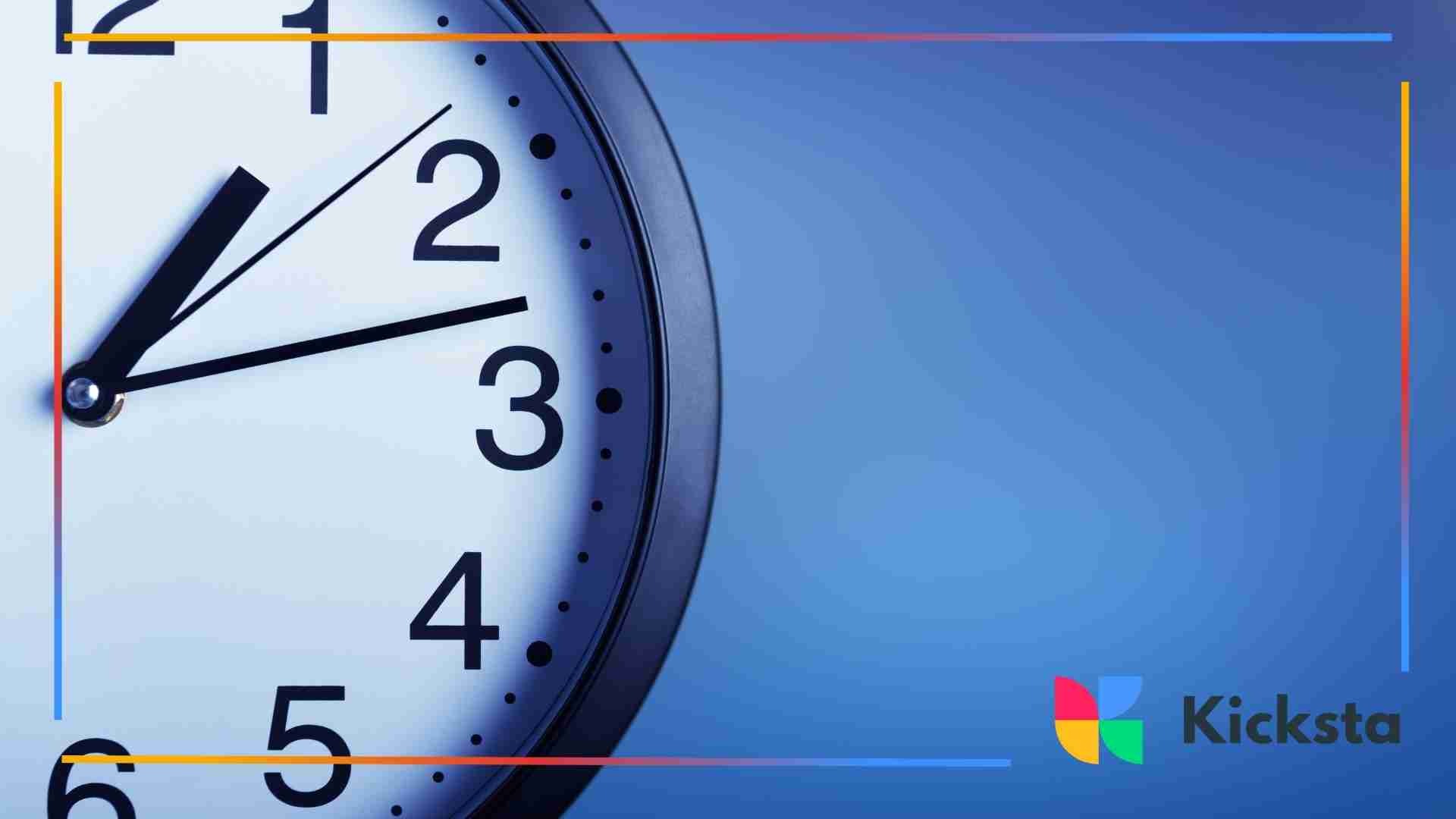 A close-up of a wall clock showing the time around 2:18, set against a blue background.