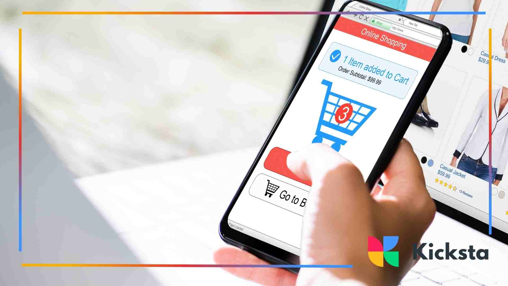 A person holding a smartphone showing an online shopping cart with three items and product listings in the background.