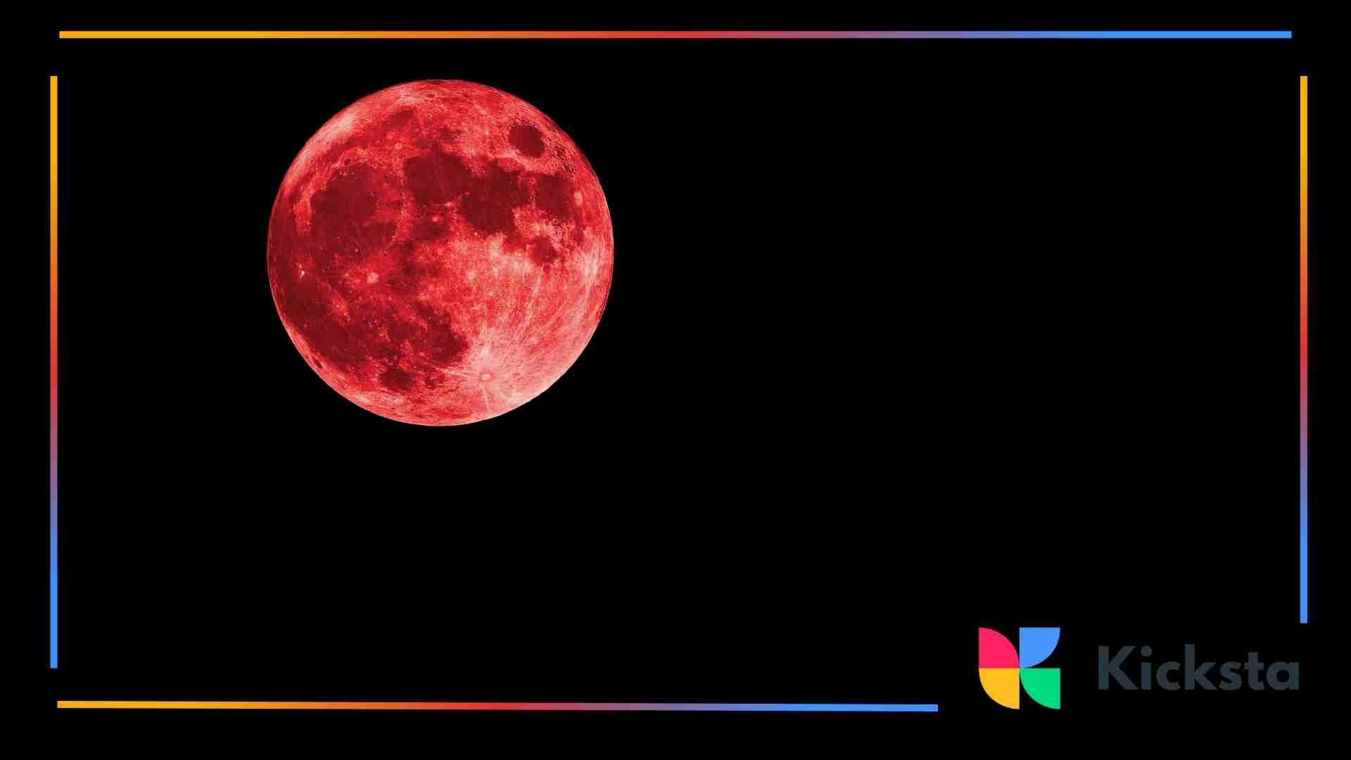 Bright red full moon set against a black night sky.