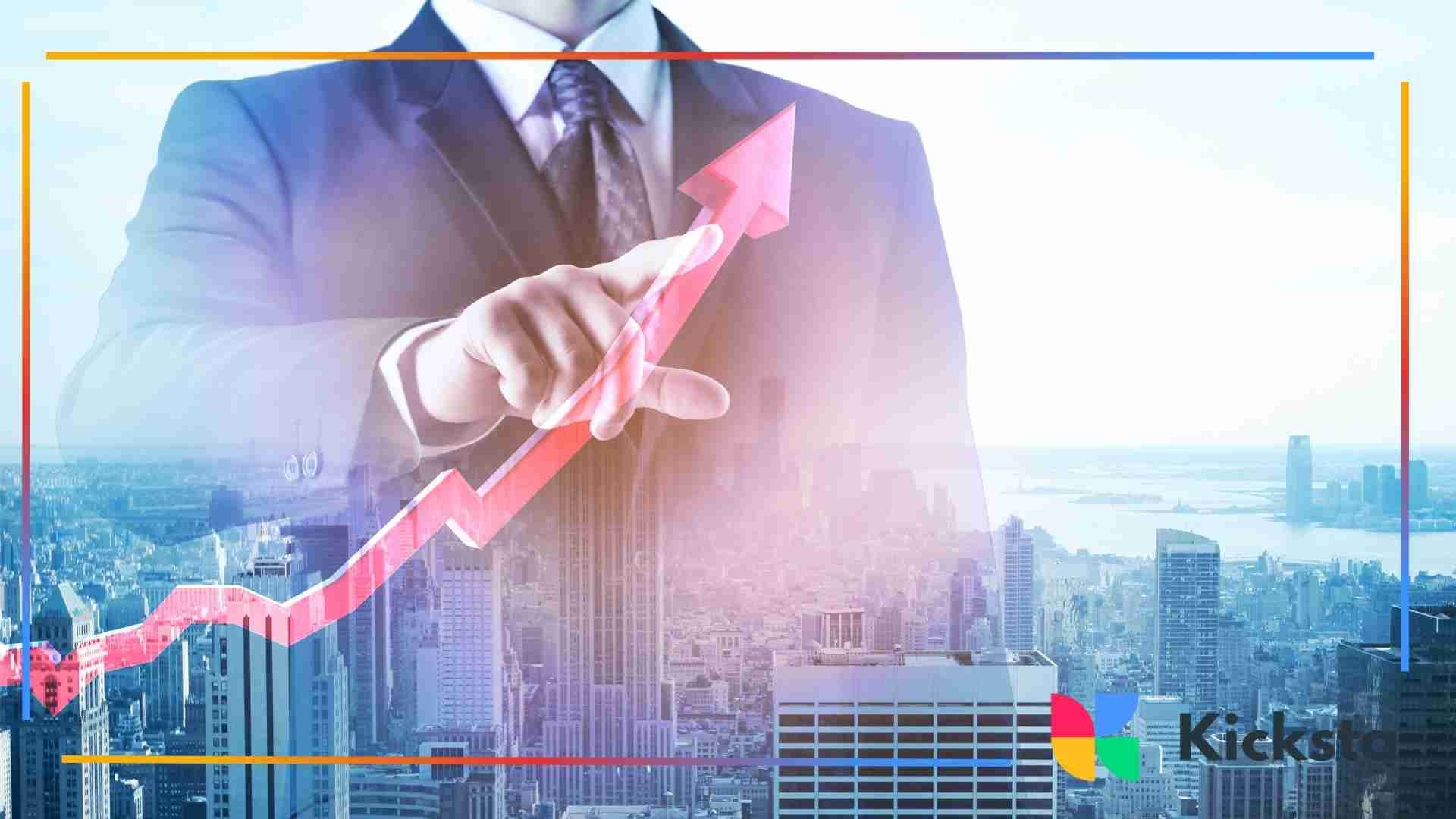 A businessman in a suit touching a rising arrow graph overlayed on a city skyline, symbolizing growth and success.