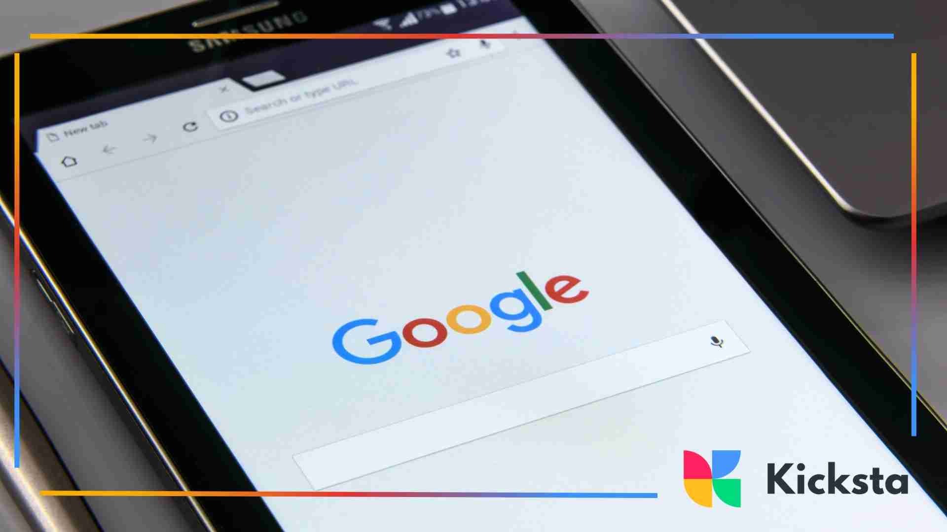 A close-up of a tablet screen displaying the Google homepage with the search bar visible.