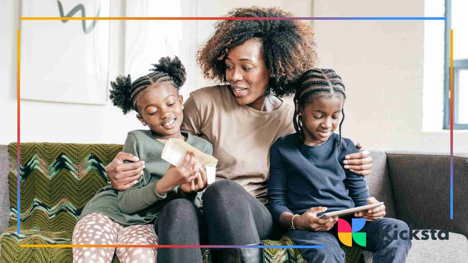 A mother sitting with her two children on a couch, reading and enjoying time together, with a cozy interior in the background.