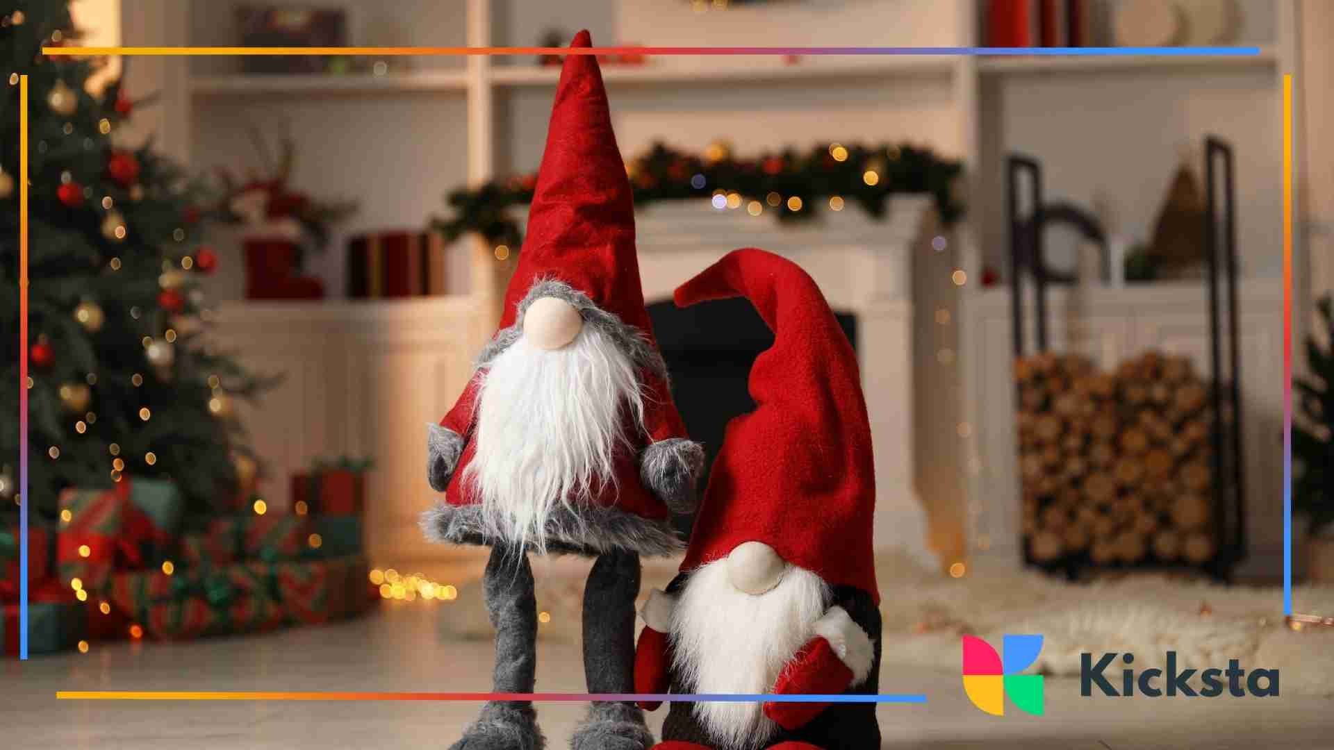 Two Christmas gnome figurines with red hats standing in a festive living room near a fireplace and holiday decor.