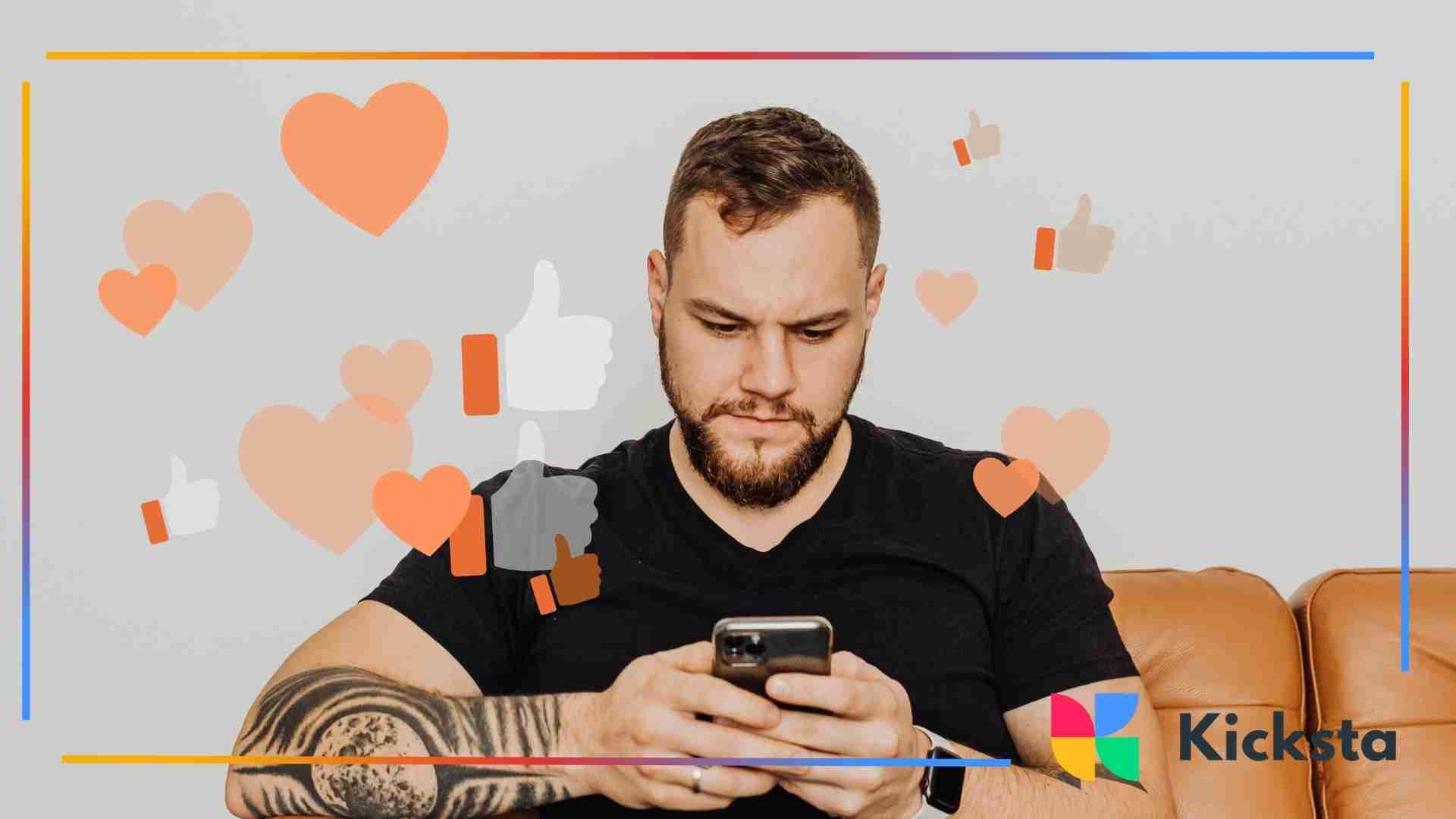 Man sitting on a couch looking at his phone as heart and thumbs-up reaction icons appear around him.