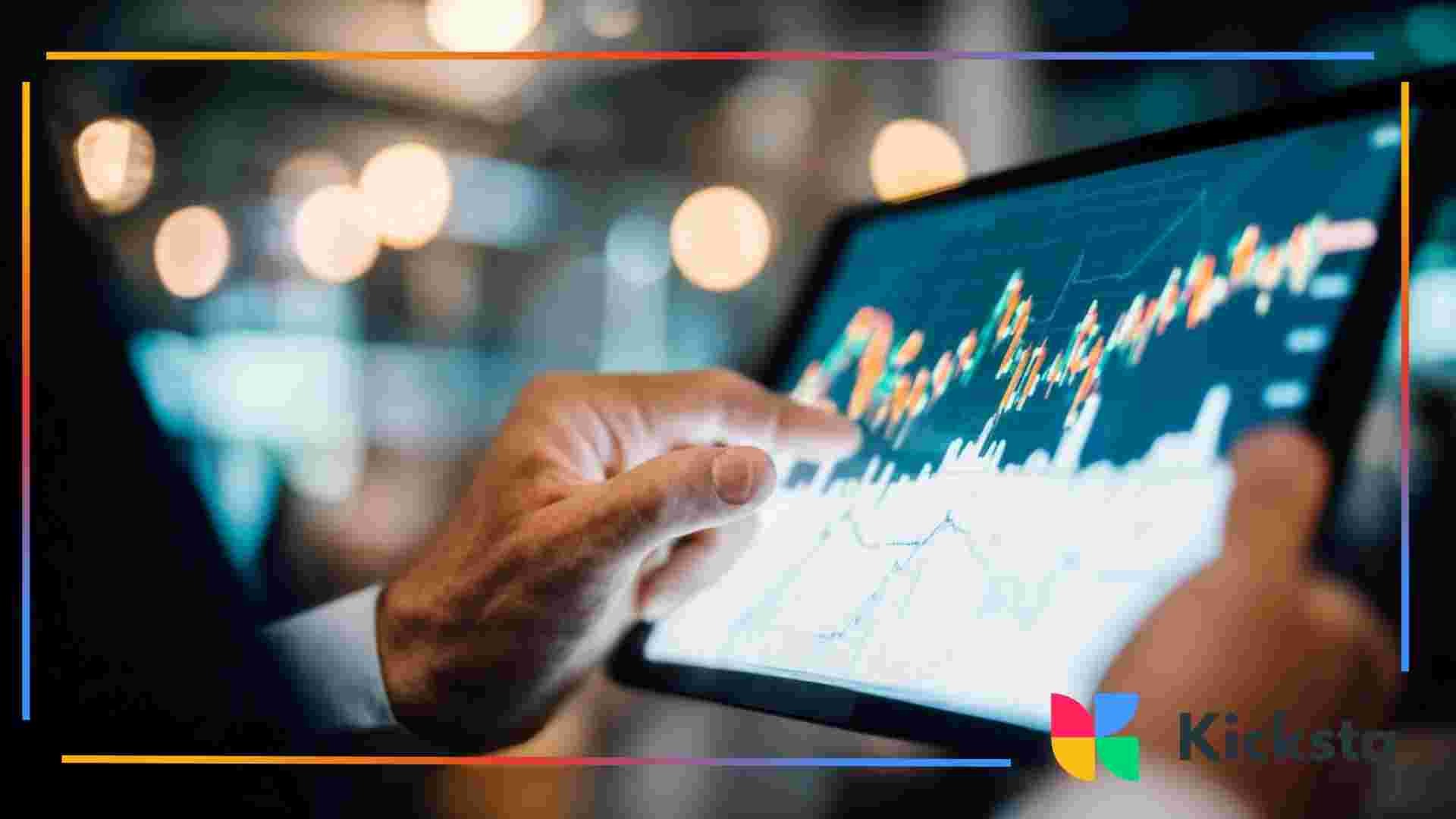 Person touching a tablet screen displaying a rising line graph and market data.