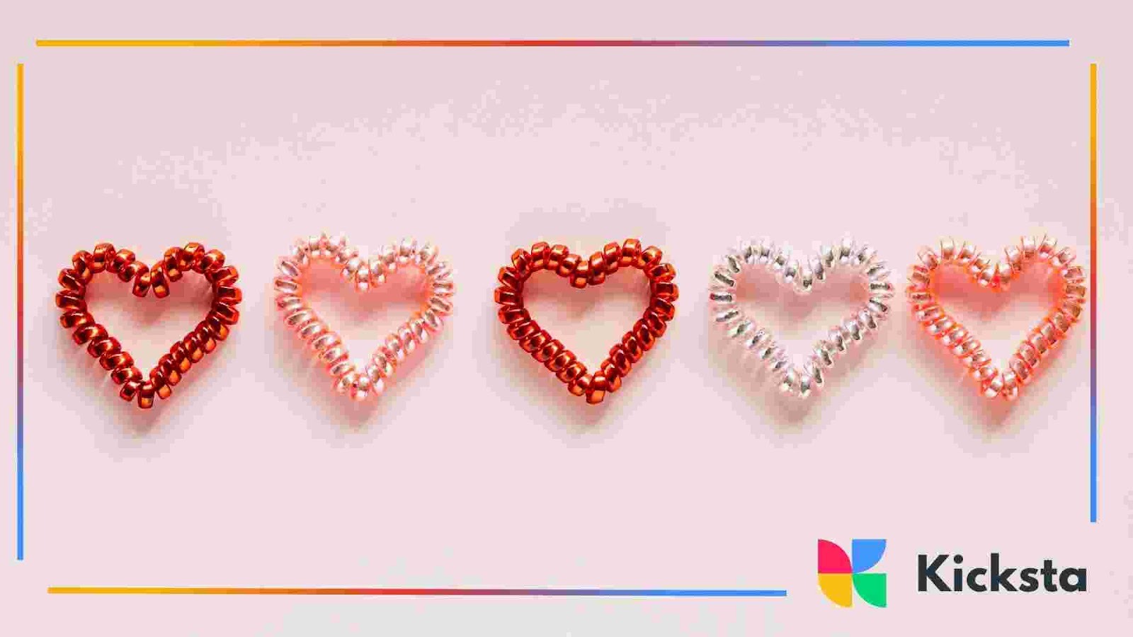 Five heart shapes made from shiny ribbon arranged in a row on a light pink background.