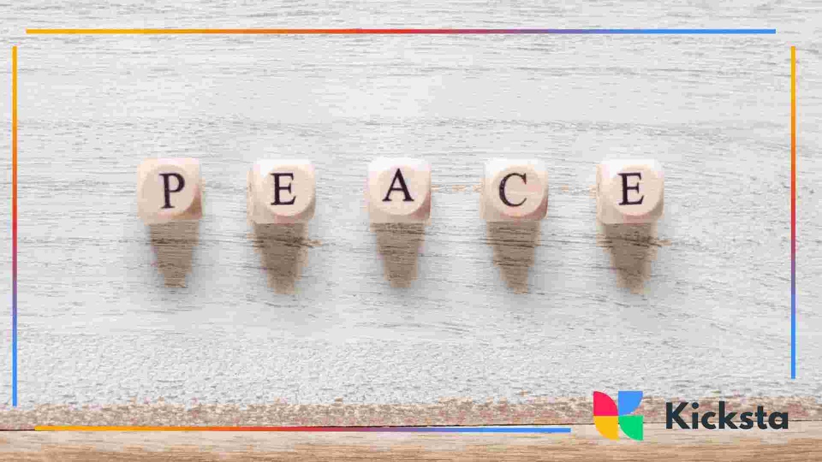 Wooden letter blocks arranged to spell the word “peace” on a light surface.