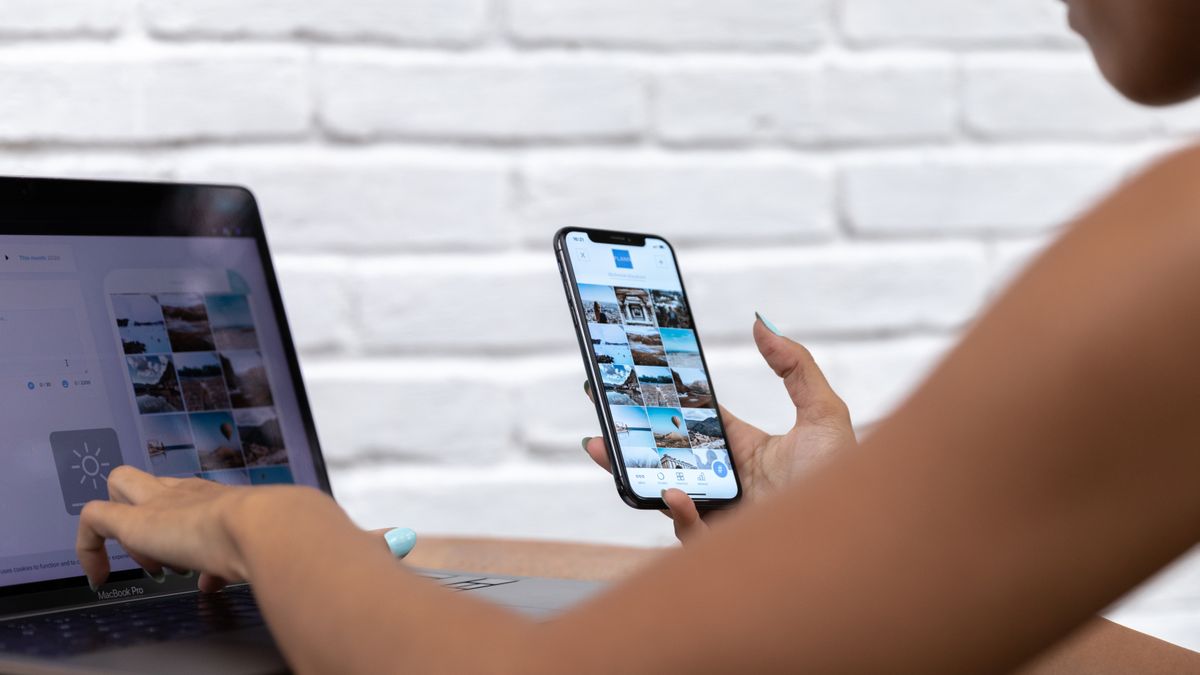Content creator managing messages on smartphone for business communication