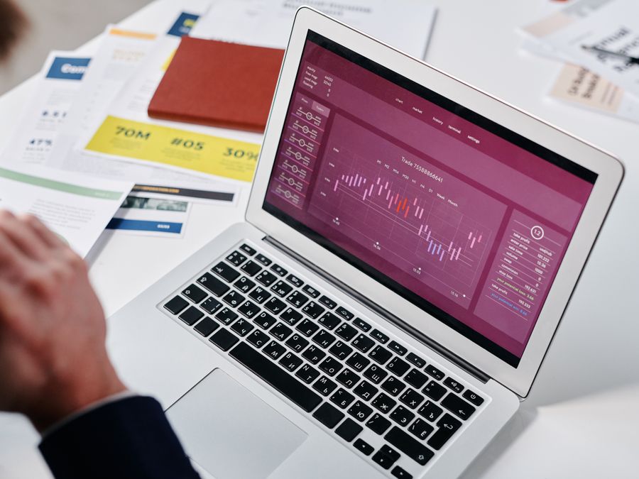 Person reviewing social media analytics and reports on laptop