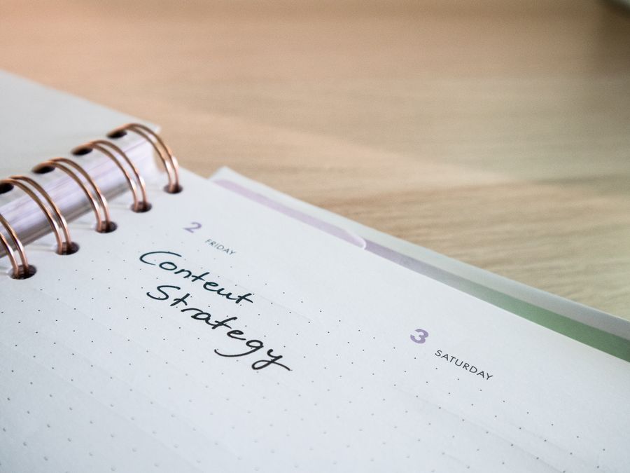 Creator workspace with content calendar and planning materials
