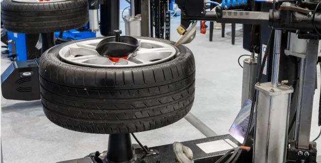 Close-up of a tire being mounted on a rim