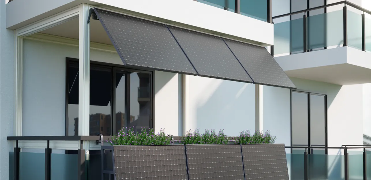 Modern balcony with frosted glass panels and black metal railings attached to a white building.