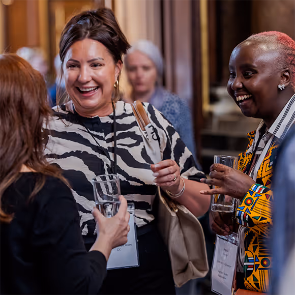 Grants Officer Letizia is speaking with two charity representatives at The Foundations annual Charities Reception.