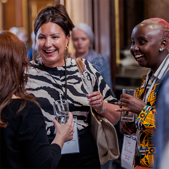 Grants Officer Letizia is speaking with two charity representatives at The Foundations annual Charities Reception.