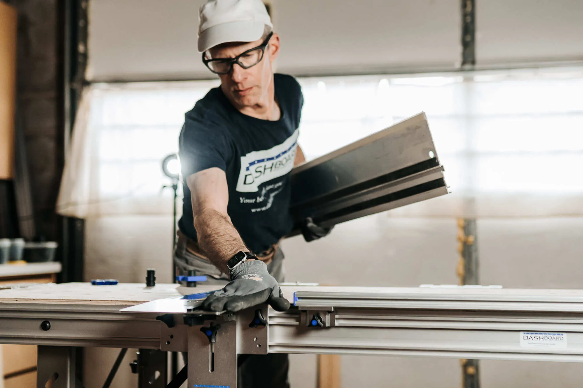 Man adjusting accessories on his workbench